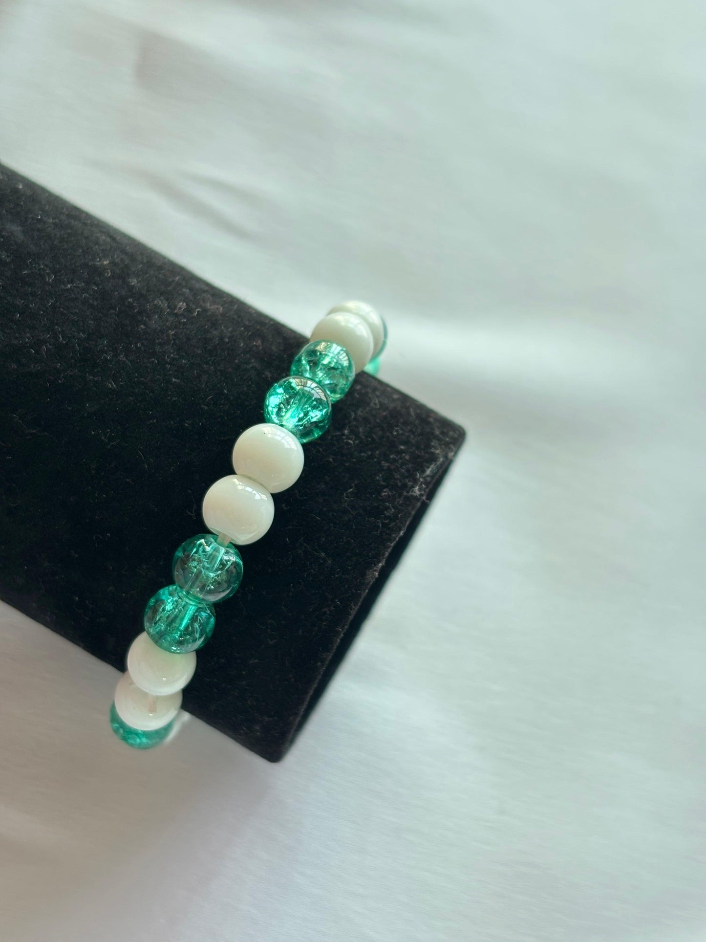 Festive Holiday Bracelet Set featuring vibrant greens and sparkling whites, perfect for the holiday season.