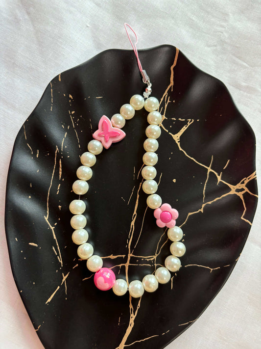 Pink Pearl Phone Charm featuring pink beads and pearls on black marble background