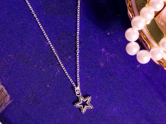 High-quality brass and stainless steel Star Chain necklace with a unique star design and anti-tarnish properties. Perfect for any outfit.