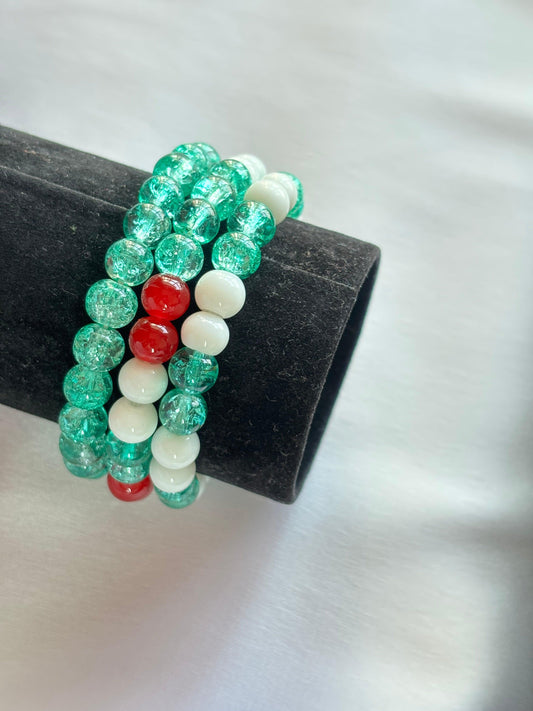 Festive holiday bracelet set featuring green, red, and white beads for a cheerful seasonal accessory.